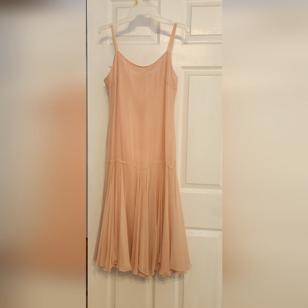 Shirt and dress shirt is a medium and the dress is a size 10 the color is peach